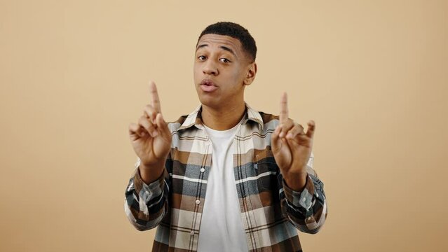 Ok, stop it. Young african american man gesturing STOP to camera with both hands, denying proposition