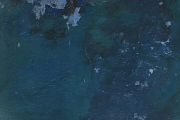 Old flaky wall with destroyed plaster. Renovation of old house. Industrial style design wall background. Grunge cracked concrete wall with old paint. Shabby peeling old background