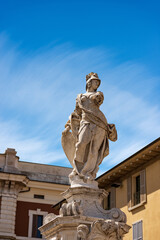 Naklejka premium Brescia. Closeup of the marble statue and fountain of Brescia Armata (Brescia Armed) by the Italian sculptor Antonio Calegari (1699-1777). Square Piazza Paolo VI or Piazza del Duomo. Lombardy, Italy.