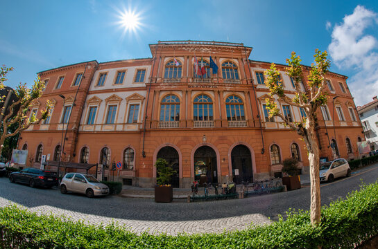 Savigliano, Cuneo, Piedmont, Italy - May 04, 2022: the Town Hall building in Corso Roma on blue sky with sun. Fish eye vision
