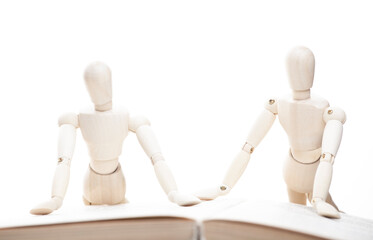 image of wooden figure book white background 