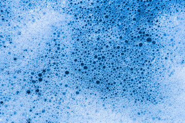 blue foamy water close-up. white bubbles