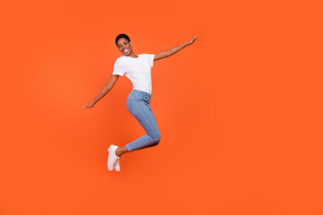 Fototapeta na wymiar Full body photo of short butch hair androgyne lady jump hands plain wings unisex look isolated bright color background