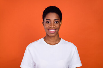 Portrait of androgyne woman toothy smiling in camera isolated over vivid shine color background