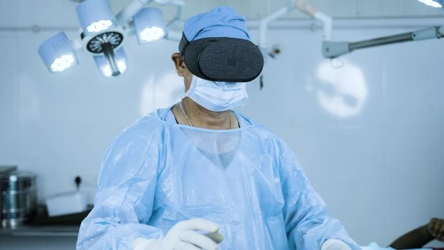 Surgeon operating surgery using VR goggles at hospital operation theater - concept of modern healtcare technology, vitual reality and futuristic
