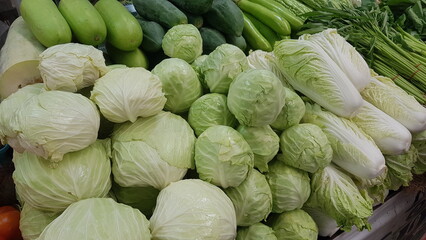 Various vegetables on the shelves in the fresh market.