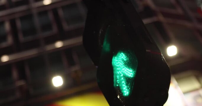 A night traffic light in Shinjuku rainy day handheld
