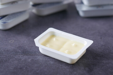 fresh butter in a small container on black 