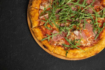 Pizza with prosciutto and cheese. Top view. Free copy space.