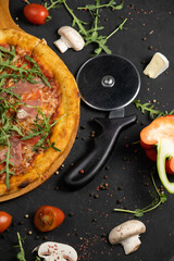 Pizza with prosciutto and cheese. Top view. Free copy space.