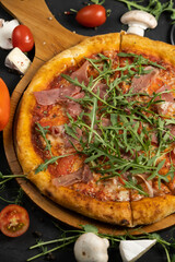 Pizza with prosciutto and cheese. Top view. Free copy space.