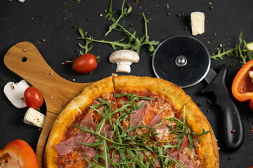 Pizza with prosciutto and cheese. Top view. Free copy space.