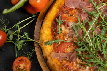 Pizza with prosciutto and cheese. Top view. Free copy space.