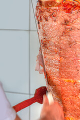 Traditional turkish food doner kebab. Turkish doner kebab is being cut before serving