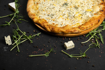 Pizza with cheese on a black background. Khachapuri