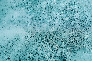 blue foamy water close-up. white bubbles