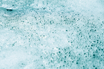 blue foamy water close-up. white bubbles