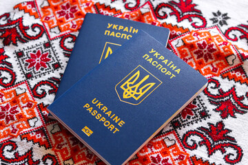 Ukrainian biometric passports. Ukrainian international passport on an embroidered towel with a national ornament.