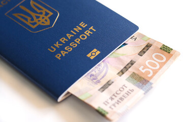 Ukrainian biometric passport. Ukrainian international passport with money inside isolated on a white background.