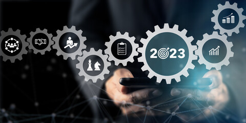2023 Goal plan action, Business plan and strategies. Business annual plan and development for achieving golas. Goal acheiveement and success in 2023. Businessman showing  smart 2023 goals icons.