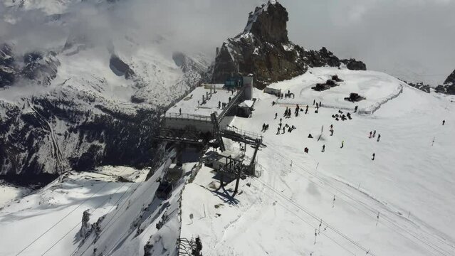 Cable car to the top of Hintertux glacier. 3000 meters above see level. Aerial shot of high mountains in Austrian ski resort in Zillertal, Tyrol. Sunny day in heart of Alps.
