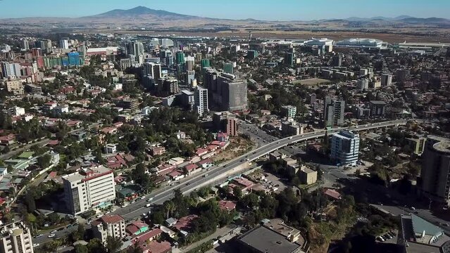 Addis Ababa, the capital of Ethiopia. Amazing aerial cityscape, with highway traffic, commercial skyscrapers, modern metropolitan city.