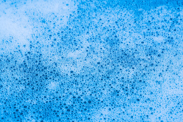 blue foamy water close-up. white bubbles