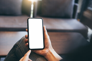 cell phone blank white screen mockup.hand holding texting using mobile on desk at office.background empty space for advertise.work people contact marketing business,technology