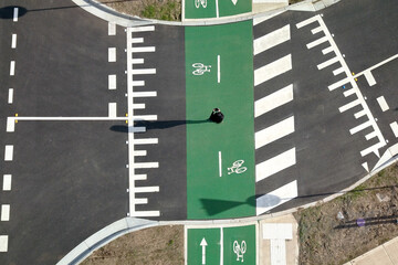 top down drone shot of person on a pedestrian crossing