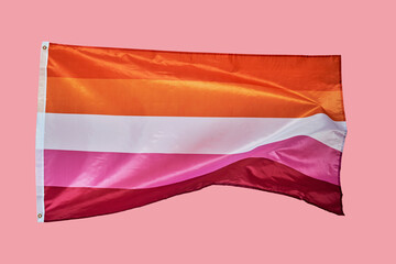 lesbian pride flag on a pink background - obrazy, fototapety, plakaty