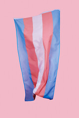 transgender pride flag on a pink background
