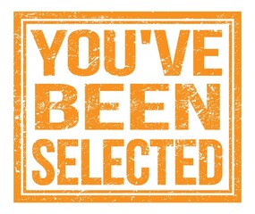 YOU'VE BEEN SELECTED, text on orange grungy stamp sign