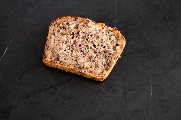 Cereal bread on black table