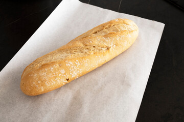 White bread on parchment on a white background