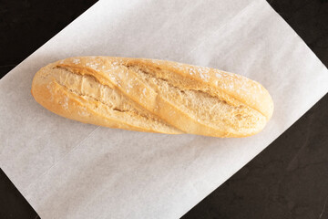 freshly baked bread on white parchment, top view. Bread on the table