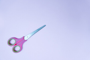 scissor isolated on blue. text space