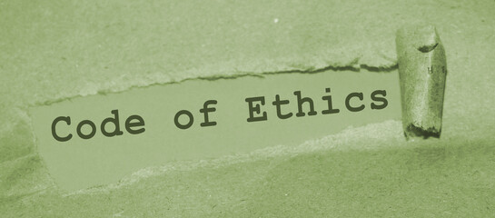 Text appearing behind torn brown envelop - Code of ethics