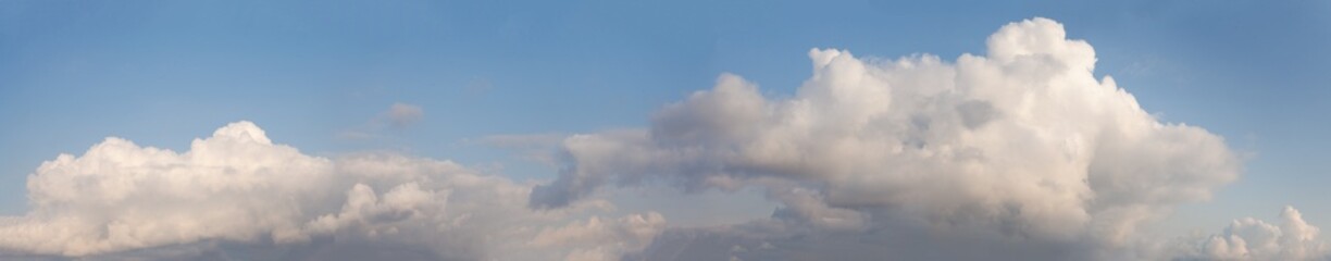 Day pastel color sky with white fluffy clouds, beautiful panoramic nature background