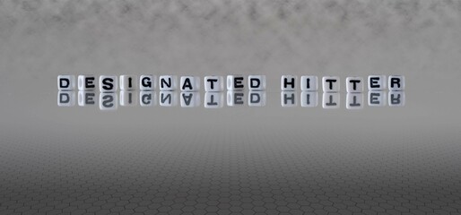 designated hitter word or concept represented by black and white letter cubes on a grey horizon background stretching to infinity