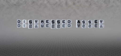 distressed asset word or concept represented by black and white letter cubes on a grey horizon...