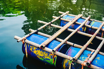 A traditional raft made of bamboo and plastic drums