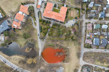 Aerial view of bloody red dyed pond in Vilnius near Russian embassy, Lithuania