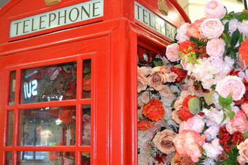 telephone booth decorated with beautiful flowers