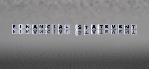 financial statement word or concept represented by black and white letter cubes on a grey horizon...