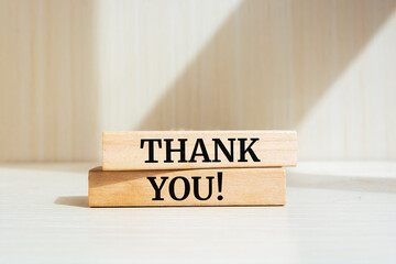 Thank you text concept written on wooden blocks lying on a table