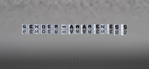 gender awareness word or concept represented by black and white letter cubes on a grey horizon background stretching to infinity