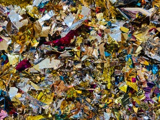 close up of colorful glittering confetti snippets