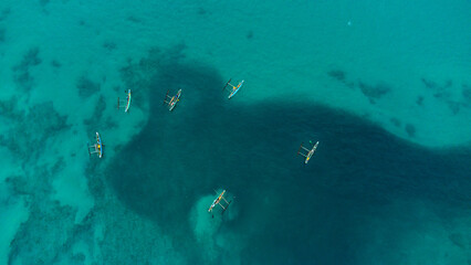 Ocean fishing boats, top view, drone shot.