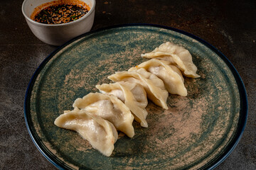 Fried dumplings with soy sauce