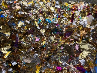 close up of colorful glittering confetti snippets